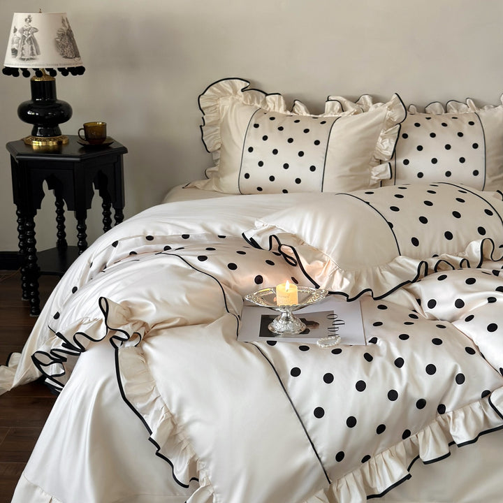 Romantic satin bedding set with ruffles, dots, and fine piping