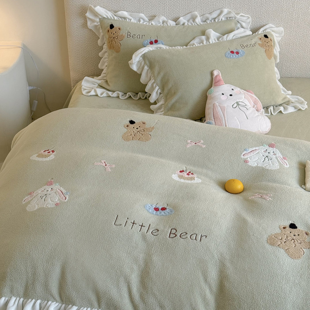 Quilted bedding set with ruffle and medallion relief