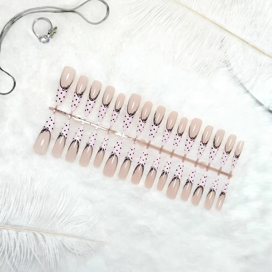 Artificial nail tips with bow pattern Stornfield