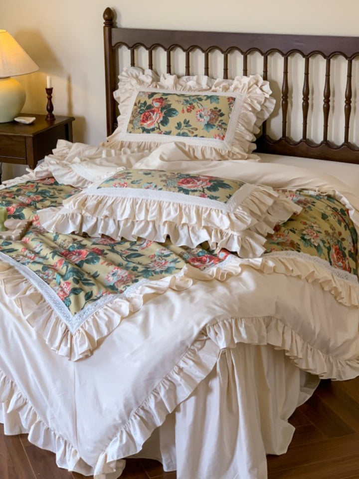 Romantic bedding set with ruffles, floral inserts and decorative pillowcase