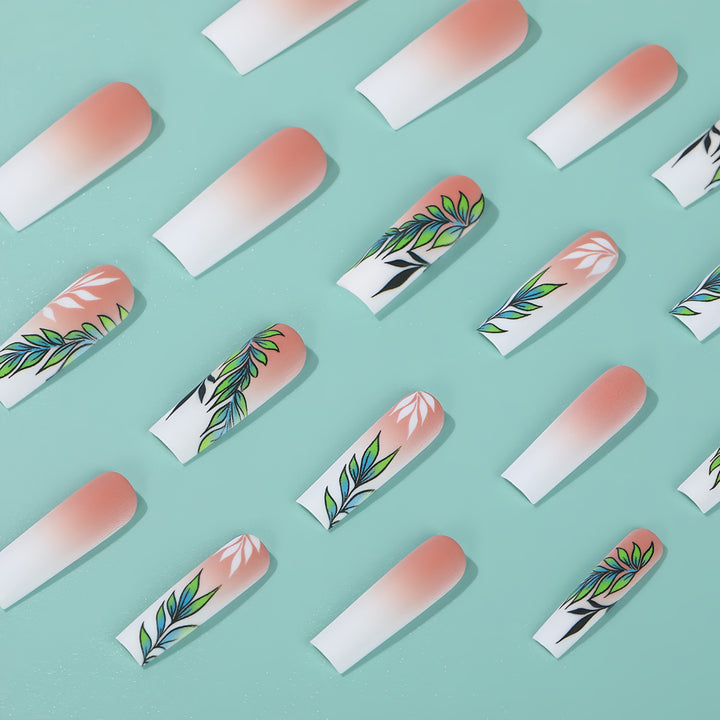Artificial nails with elegant ombre design and floral accents Stornfield