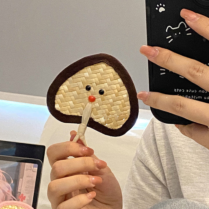 Handcrafted fan with playful face motif Stornfield