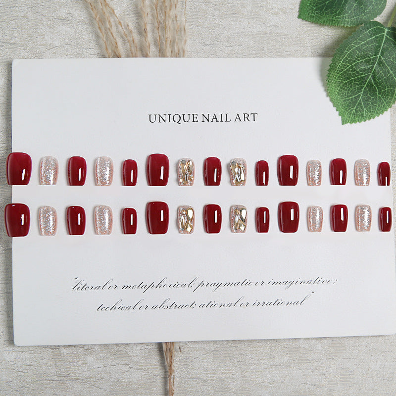 Artificial nail set with elegant glitter and metallic accents Stornfield