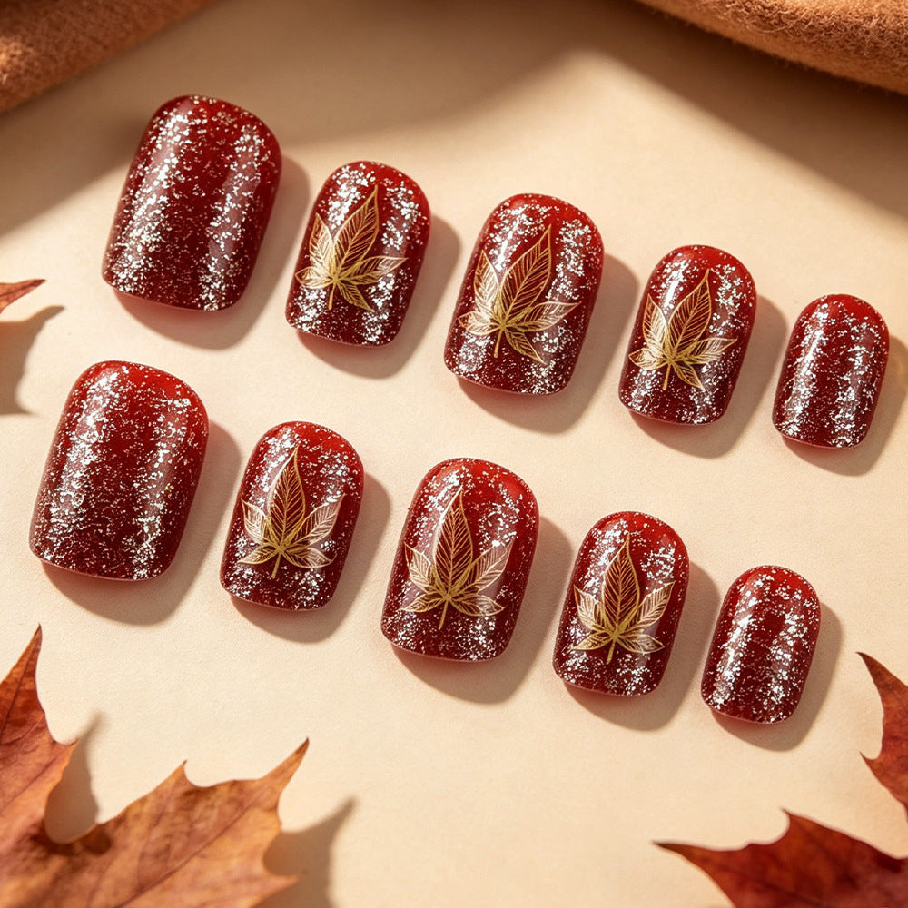 Artistic Leaf-Embellished Nail Art Design Stornfield