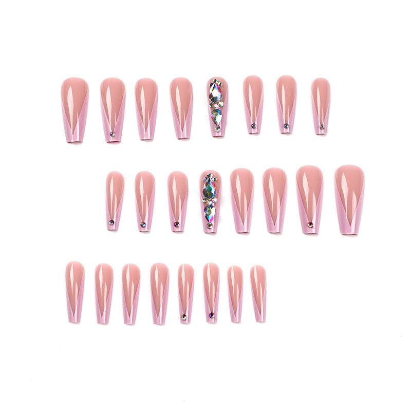 Artful nail extensions with rhinestone and flower accents Stornfield
