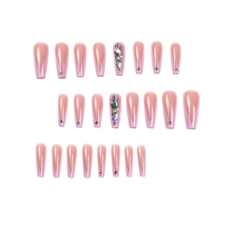 Artful nail extensions with rhinestone and flower accents Stornfield