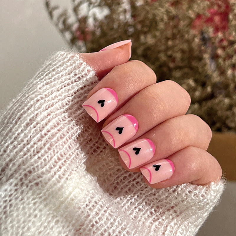 Creative Nail Art with Heart Design and Glitter Accents Stornfield