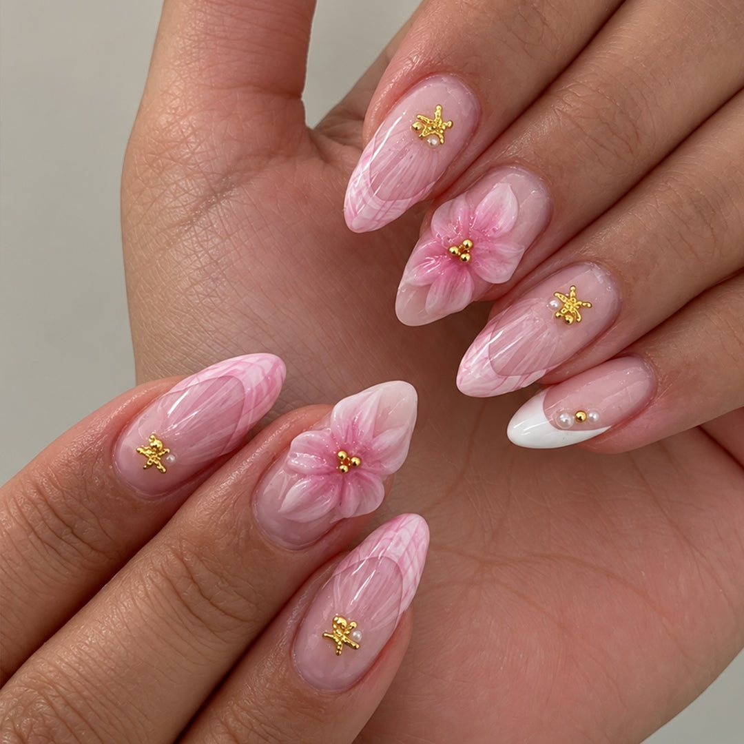 Artificial nail set with delicate flower and glitter applications Stornfield