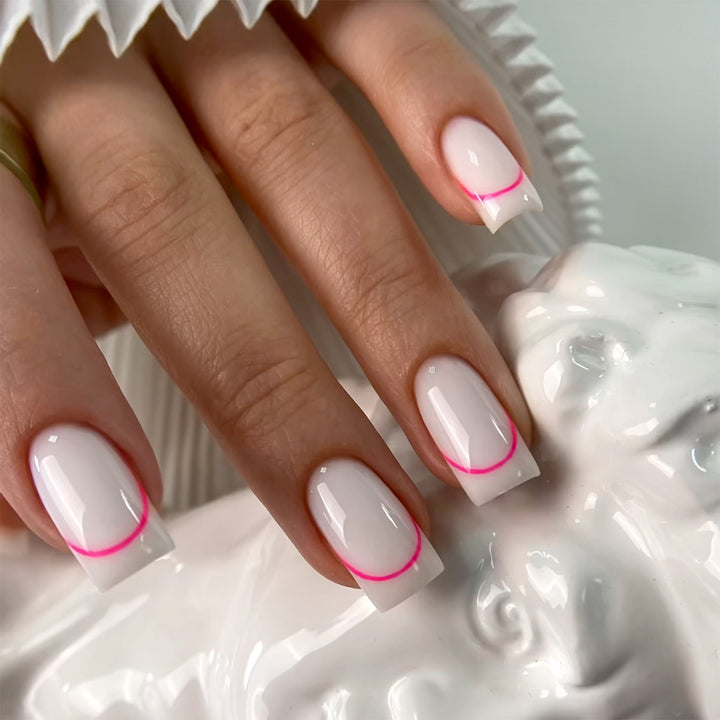 Stylish artificial nails with elegant French tip and modern accents Stornfield