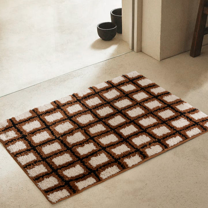 Short pile bath mat with geometric check pattern and non-slip backing Stornfield