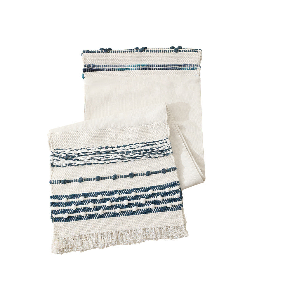 Woven cotton table runner with fringes and textured pattern Stornfield
