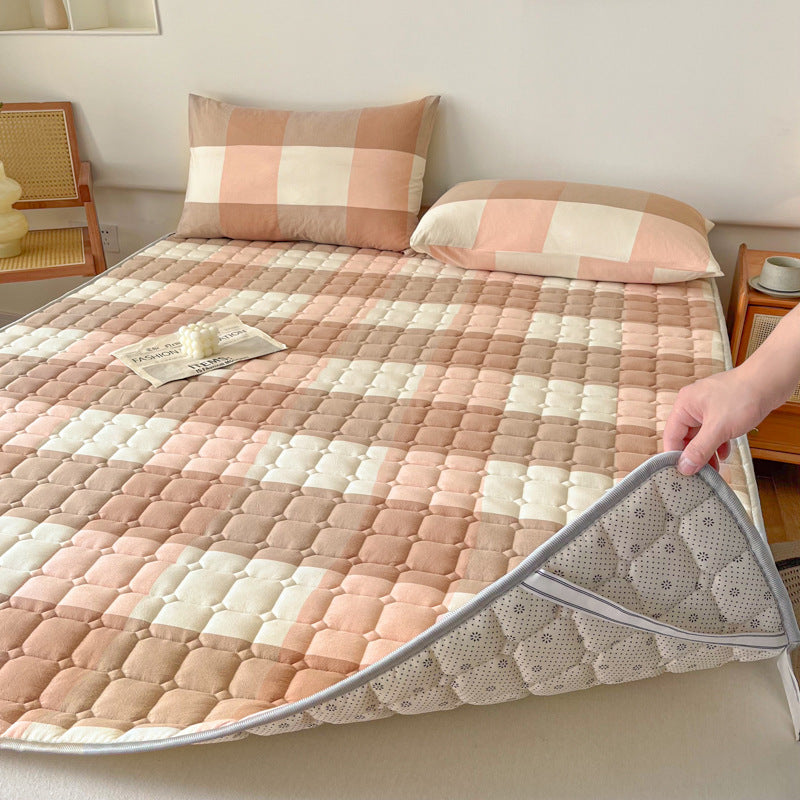 Padded mattress protector-topper with quilting and non-slip underside