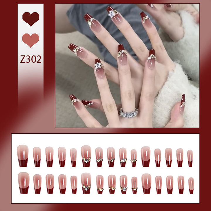 Artificial nail set with elegant glittering accents and romantic design Stornfield