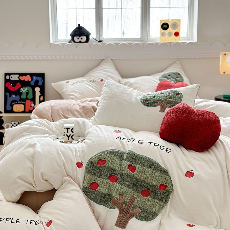 Bedding set made of soft cotton with embroidered apple tree motif and cuddly apple pillow