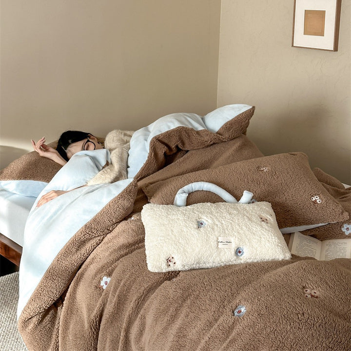 Sherpa bed blanket and reversible bed cover with embroidered flower appliqués