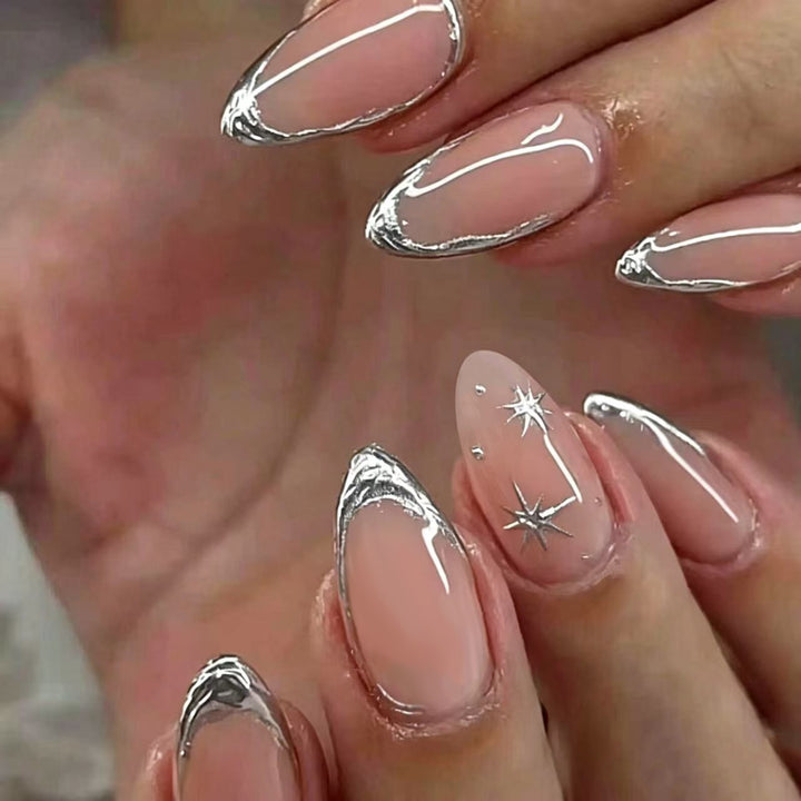 Shiny stiletto nails with elegant silver embellishment Stornfield
