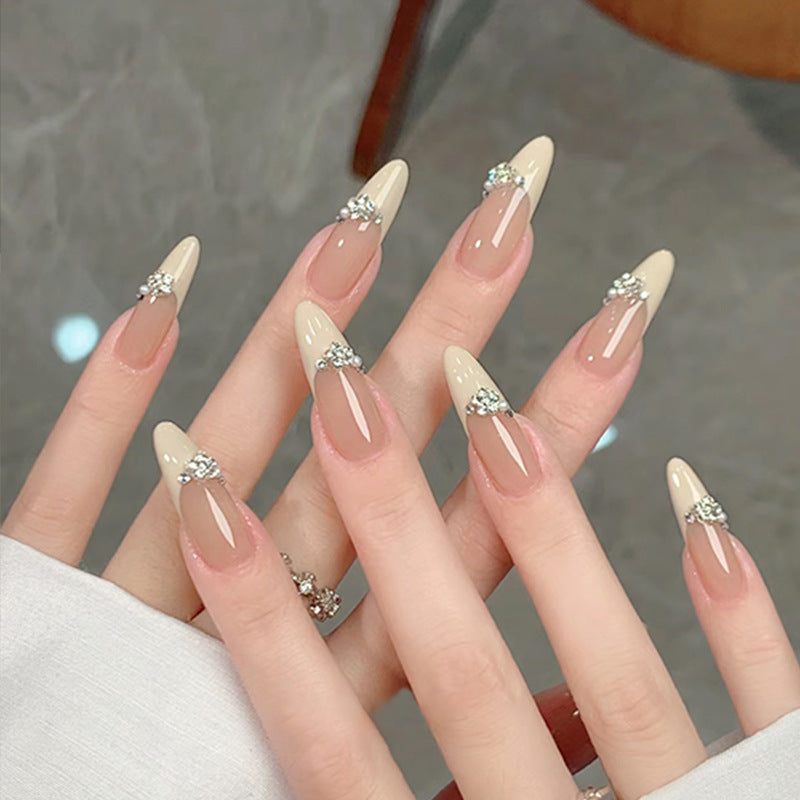 Acrylic nail set with elegant tips and sparkling appliqués Stornfield