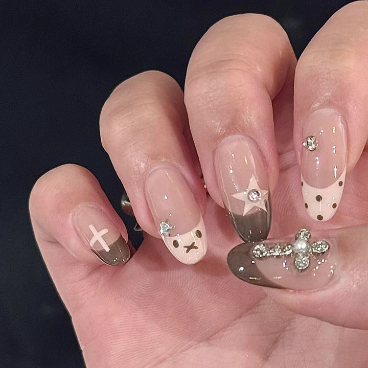 Artificial nails with creative design and sparkling accents Stornfield