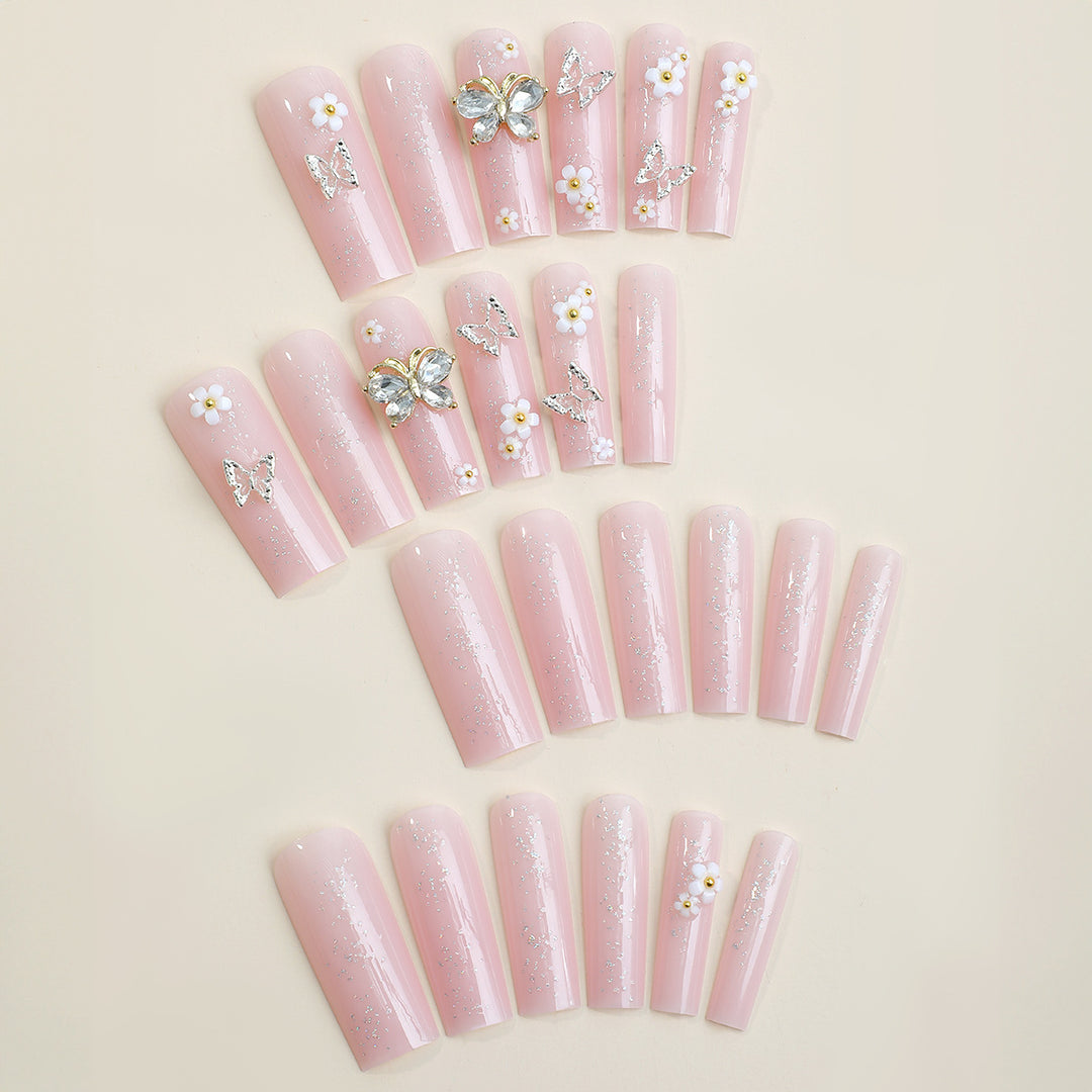 Artificial nail set with floral and glittering accents Stornfield