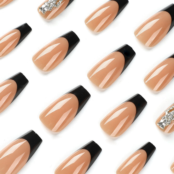 Glamorous artificial nails with rhinestones and black tips Stornfield
