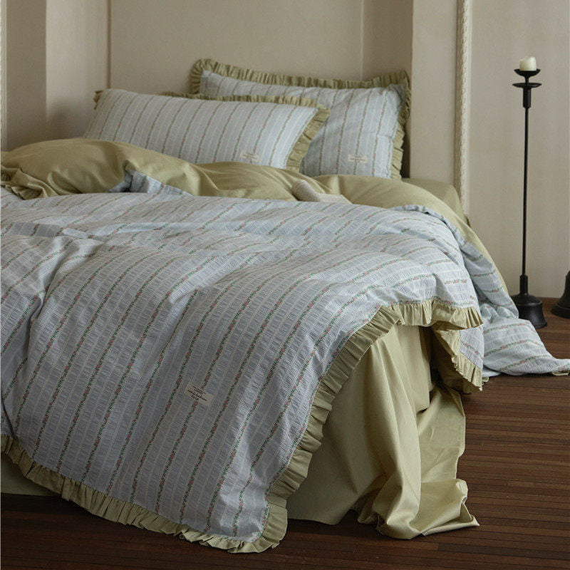 Bedding set with fine striped texture, ruffled border and breathable cotton blend