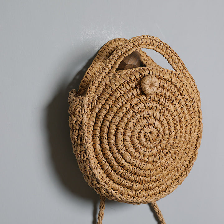 Handcrafted Round Wicker Bag with Elegant Closure Stornfield
