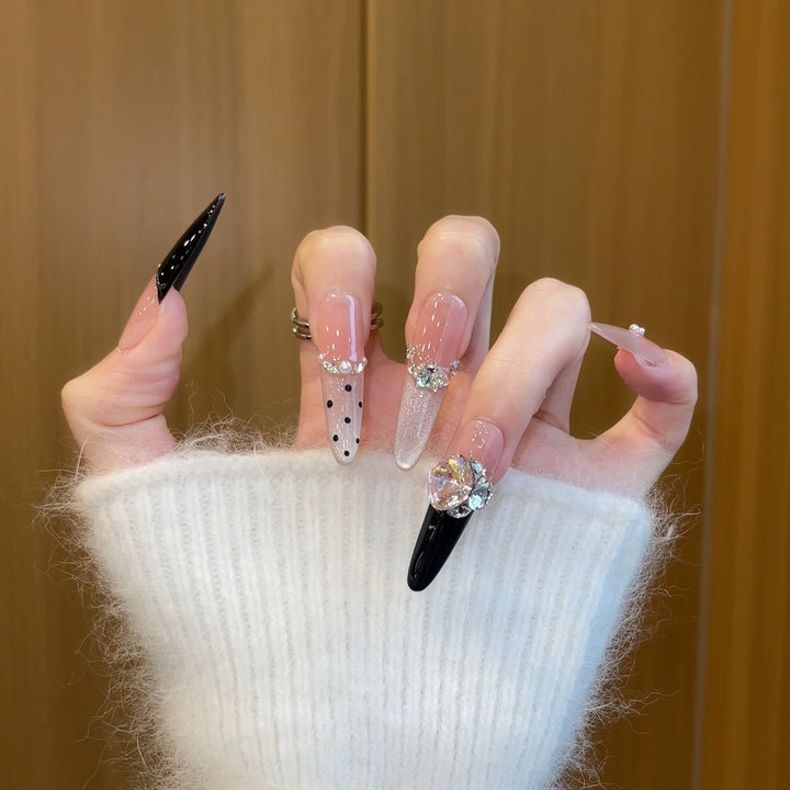 Elegant artificial nails with rhinestone and glitter elements Stornfield