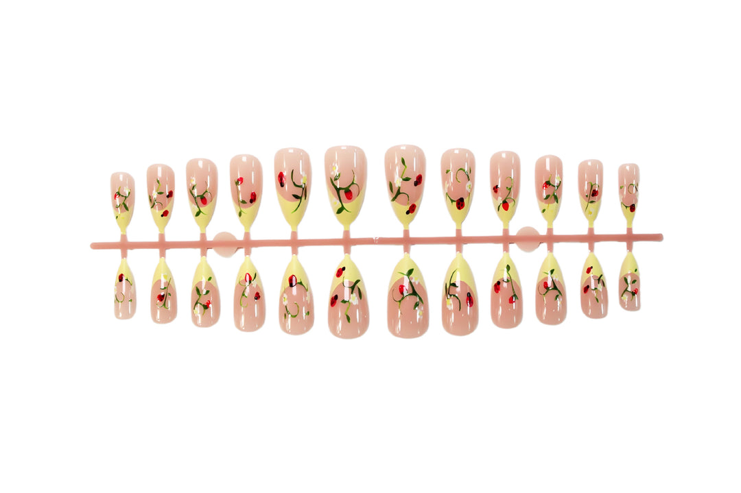Artificial nail set with elegant gradient and floral accents Stornfield