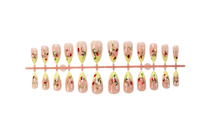 Artificial nail set with elegant gradient and floral accents Stornfield
