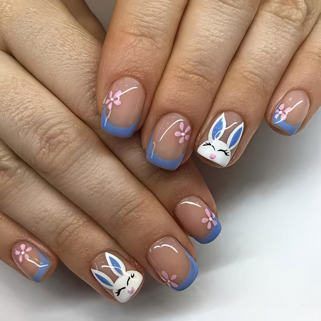 Creative nail art with cheerful bunny and flower pattern Stornfield