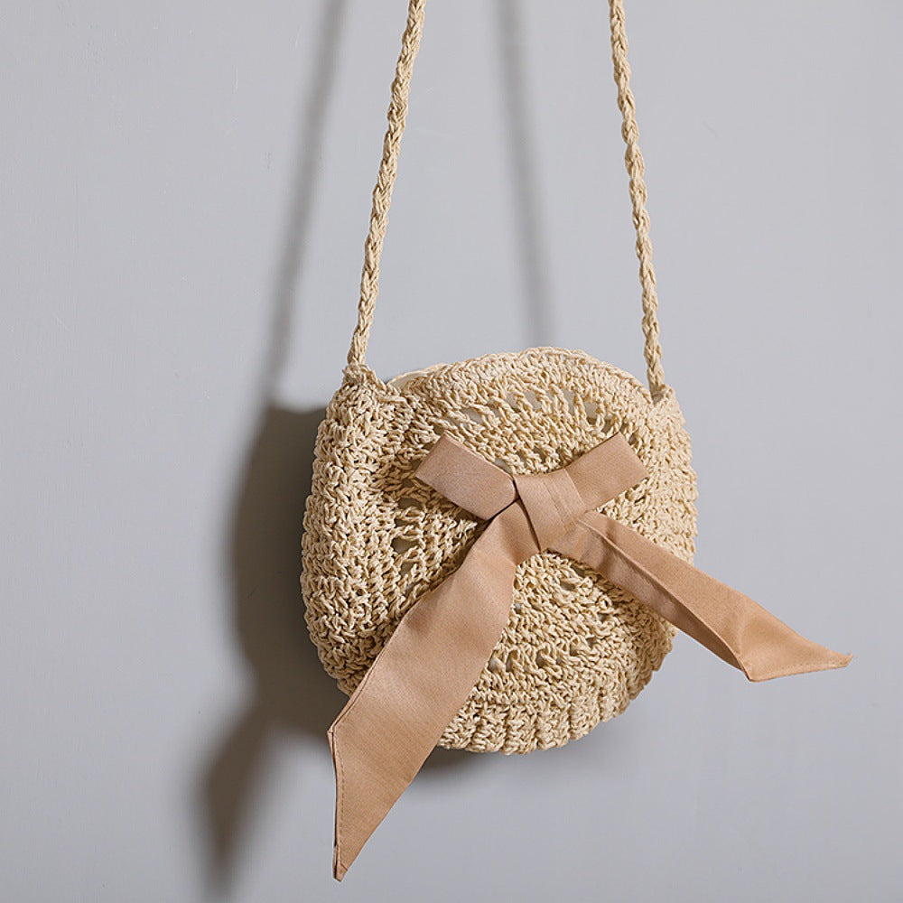 Handwoven shoulder bag with decorative bow accent Stornfield