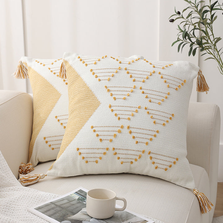 Decorative woven cushion cover with geometric tuft-relief and tassels Stornfield