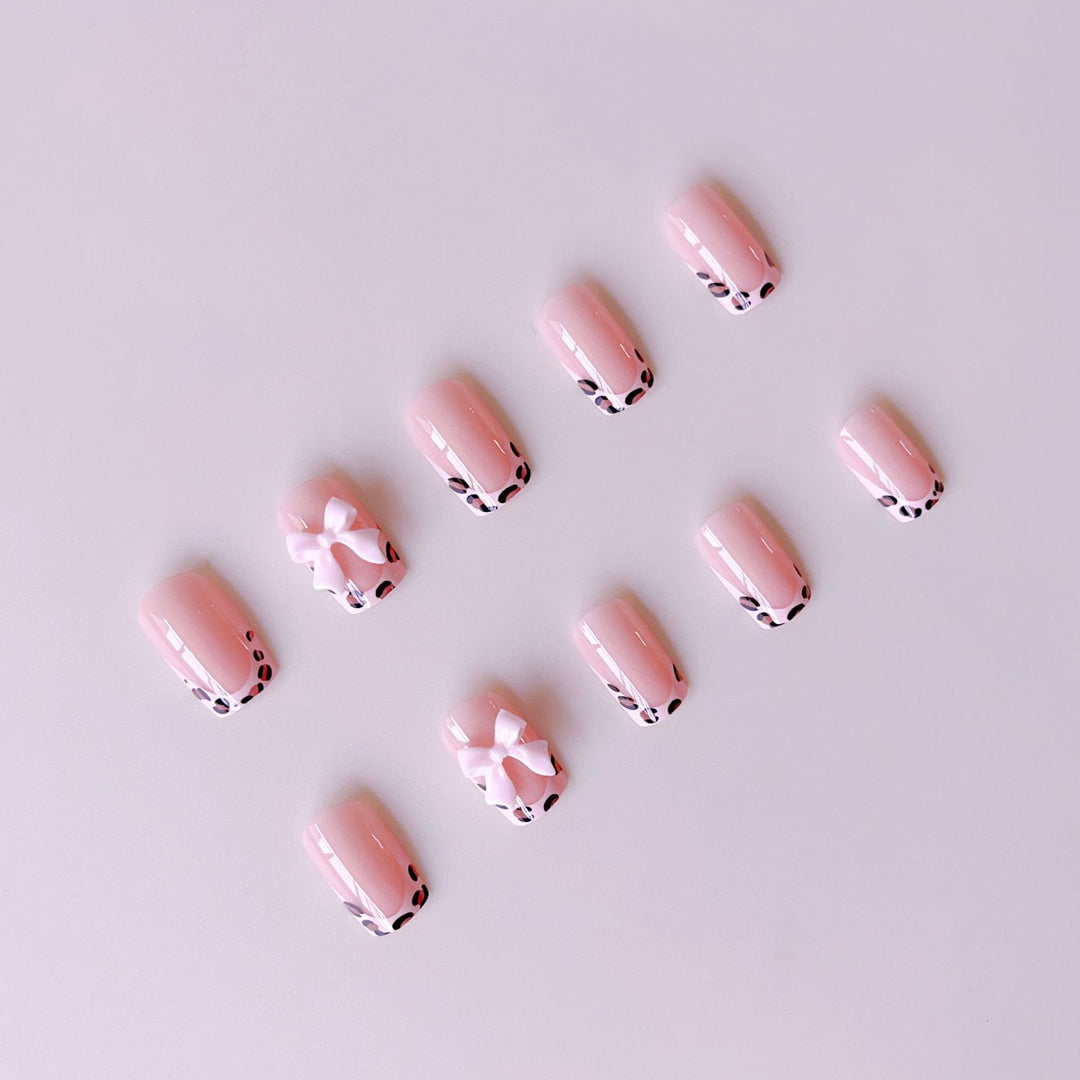 Artificial nail set with elegant leopard design and cute bows Stornfield