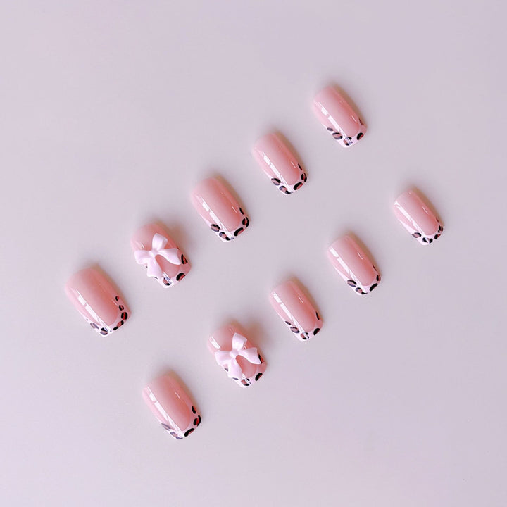 Artificial nail set with elegant leopard design and cute bows Stornfield