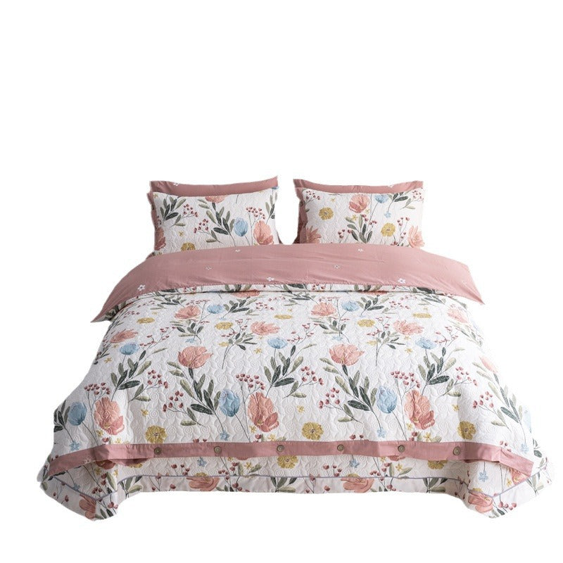 Quilted bedspread and bedding set with floral print, reversible function and decorative button placket