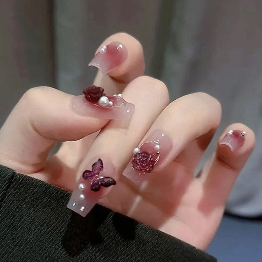 Glamorous artificial nails with delicate flower and glitter effects Stornfield