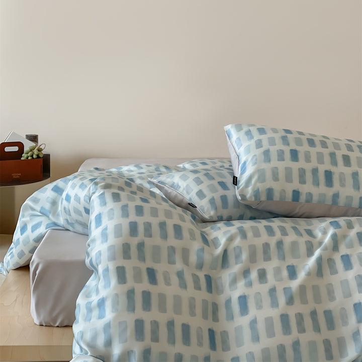 Luxurious satin bedding set with floral watercolor print, ruffled edges and reversible function