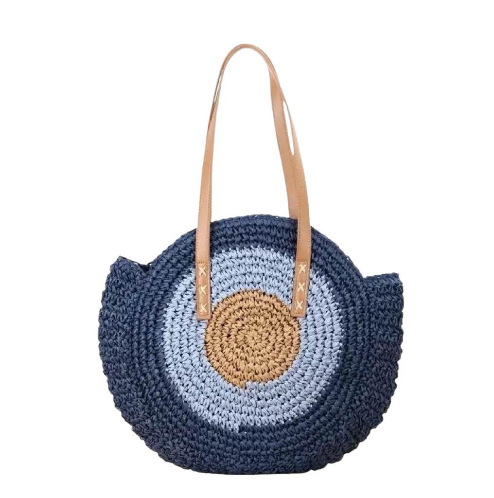 Braided basket bag with unique round design and elegant shoulder straps Stornfield