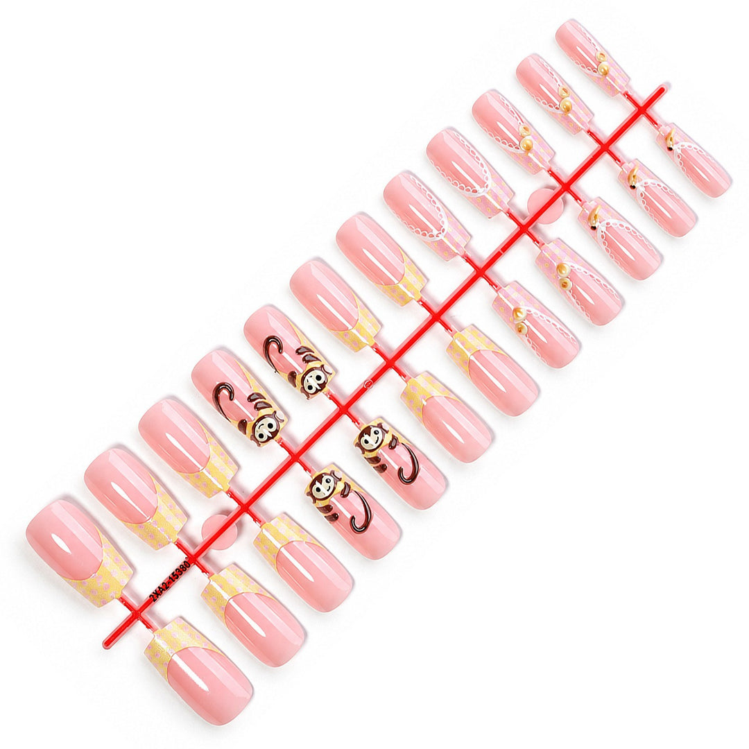 Artificial nail set with playful animal motifs and elegant embellishments Stornfield