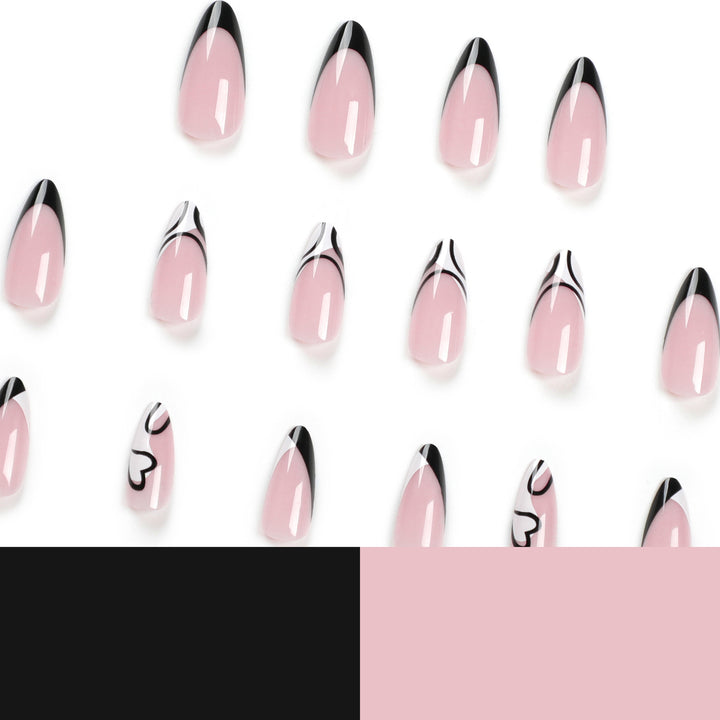 Artful stiletto nails with elegant black-and-white design Stornfield