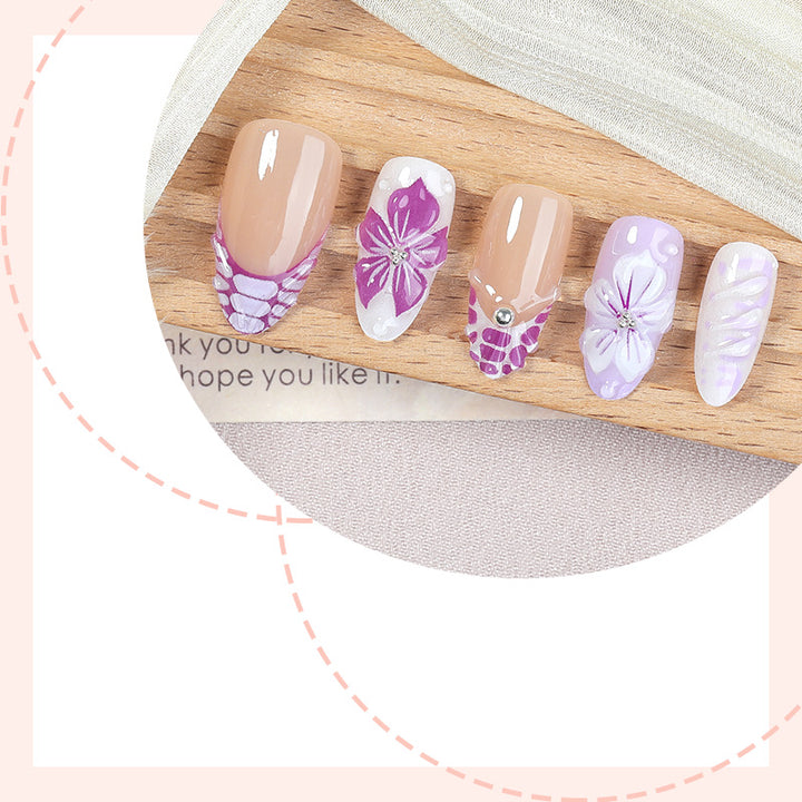 Artificial nail set with elegant flower designs and glitter accents Stornfield