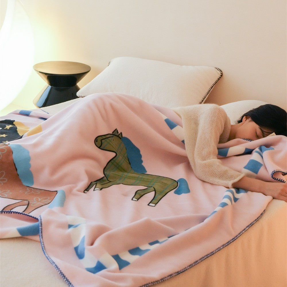Children's cuddly blanket made of soft fleece with horse print and decorative edge