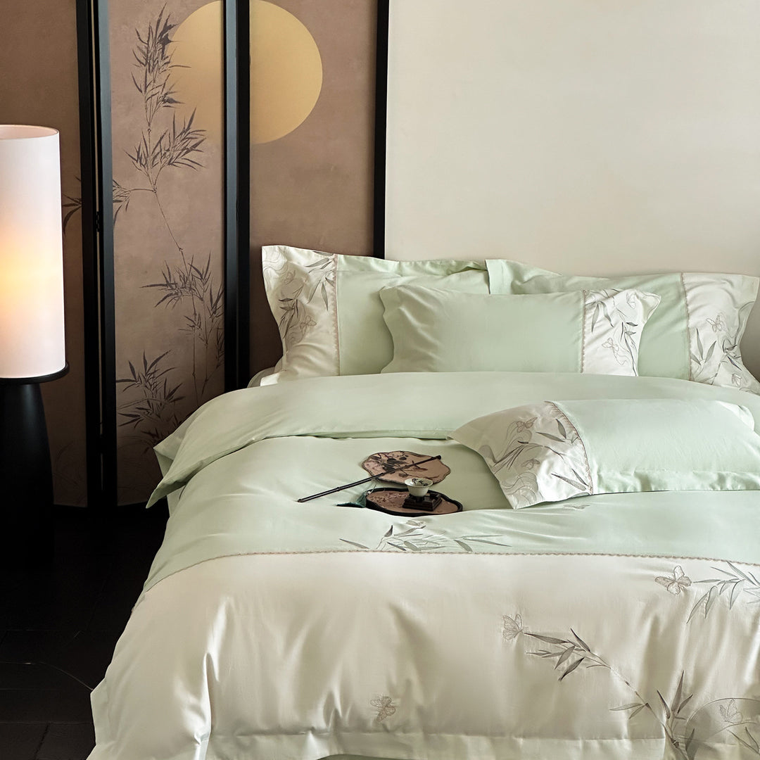 Elegant cotton satin bedding set with embroidered bamboo and butterfly border
