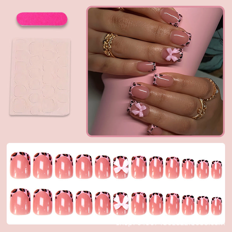 Nail set with playful bow design and lively animal accent Stornfield