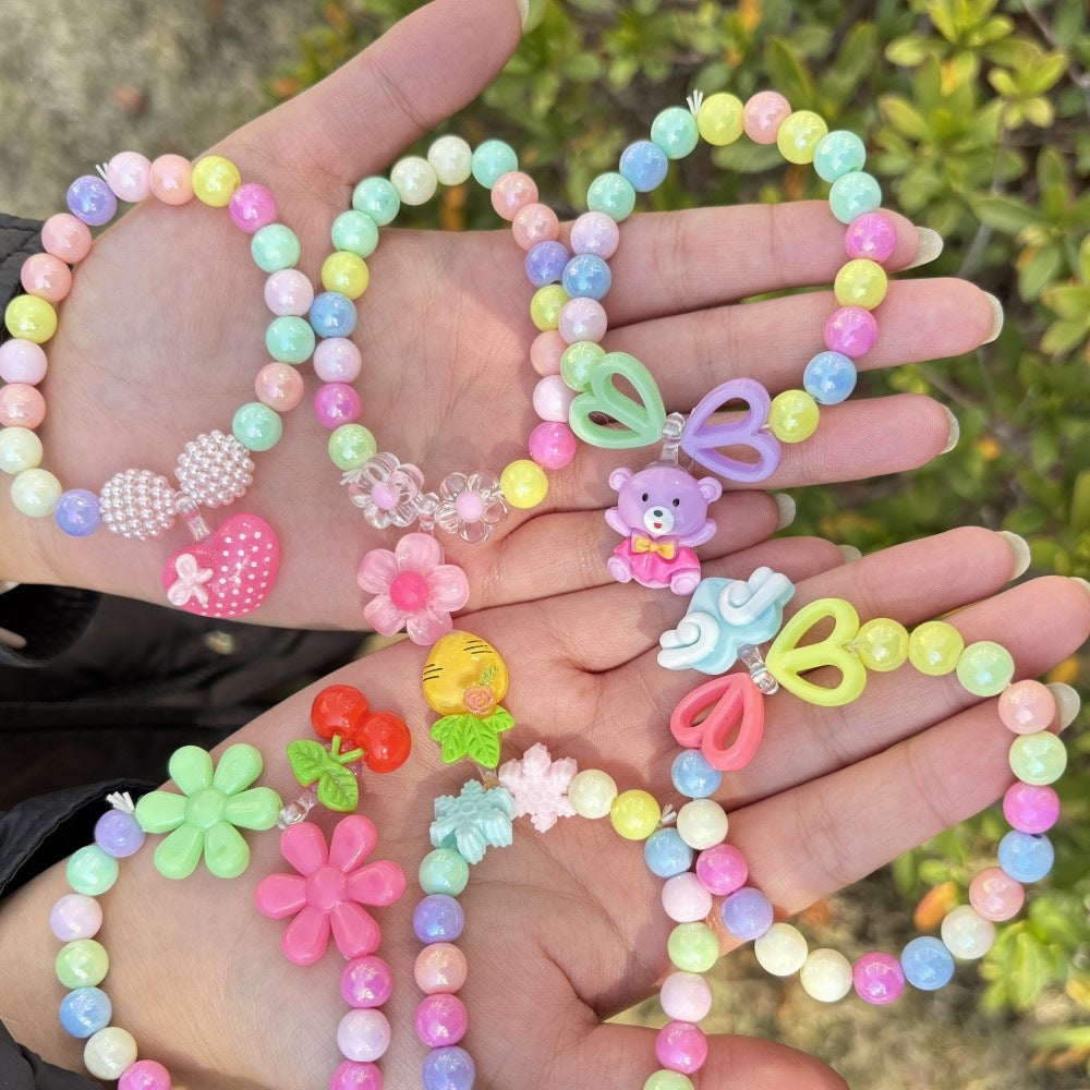 Colorful bracelet with flower charms Stornfield