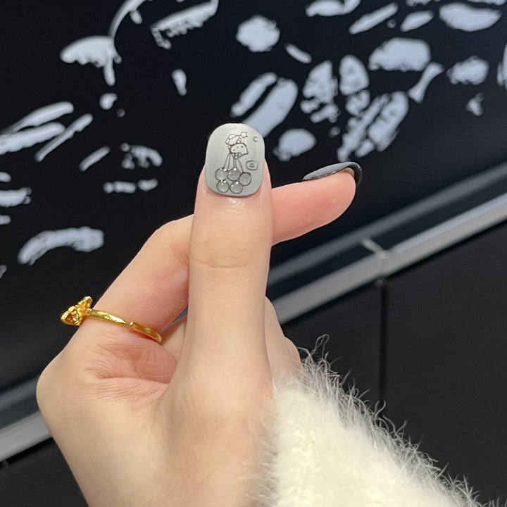 Artistic Press-On Nail Set with Whimsical Character Designs Stornfield