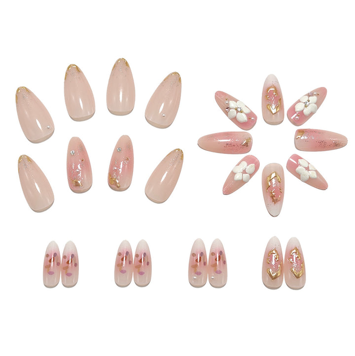 Artificial nails with delicate floral decorations and glitter effects Stornfield