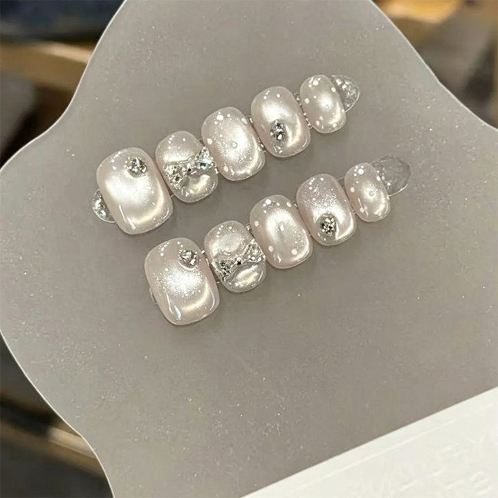 Artificial nail set with elegant glitter and crystal decorations Stornfield