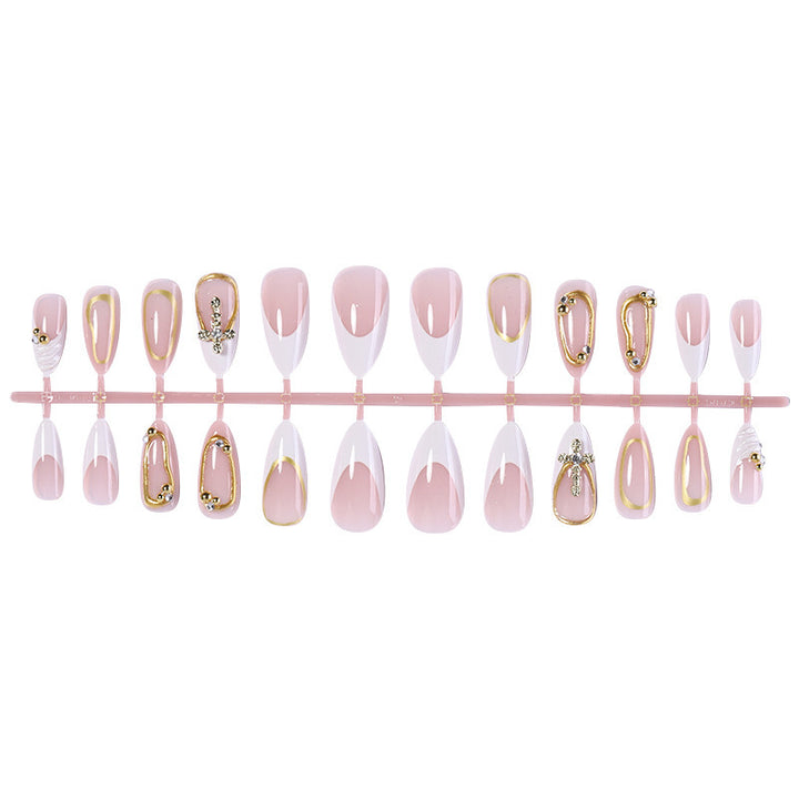 Artificial nail set with luxurious gold embellishments and elegant designs Stornfield