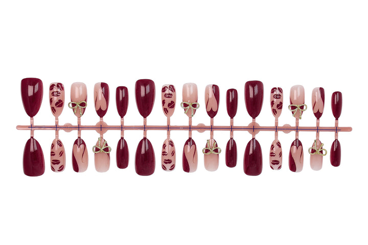 Artificial nail set with elegant bow and kiss mouth designs Stornfield